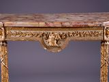 an antique console table with a marble top and a lion head on the top