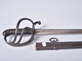 a small sword and a lighter on a white surface