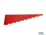 a close up of a long red piece of wood on a white background