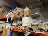 many boxes and packages on a shelf in a warehouse