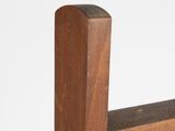 a close up of a wooden bench with a white background