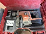 a red tool box with tools in it on the floor