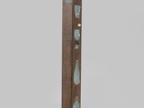 an image of a tall wooden sculpture with glass pieces on it