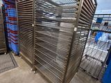 a metal rack that has a bunch of food in it