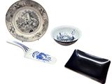 a plate, a bowl, and a fork sitting on a table