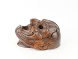 an image of a wooden sculpture of a dog on a white background