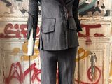 a mannequin in a room with graffiti on the wall