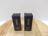 two black boxes on a wooden table with a white background