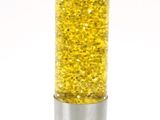 a silver and yellow lamp that is sitting on a table
