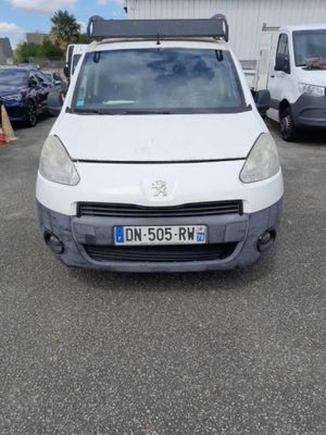 the white van is parked in the parking lot next to other cars