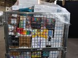 a metal cart with many items in it in a warehouse