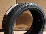 a close up of a tire on a cardboard box on a floor