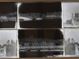 several black and white photos of a building with a clock on it