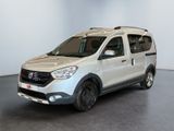 the white van is parked in a large room with a black floor