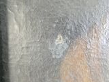 a close up of a person ' s face in a dirty pan