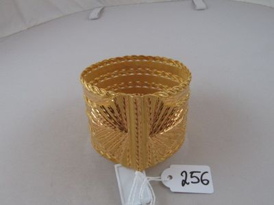 a gold basket with a price tag attached to it