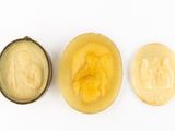 three pieces of fruit that have been cut in half