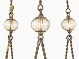 a close up of a chandelier with glass balls hanging from it