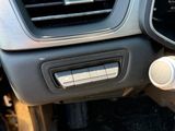 the dashboard of a car with a digital gauge and a steering wheel