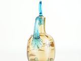 a glass bottle with a blue handle on a white background