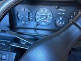 dashboard of a car with a steering wheel and gauges on it
