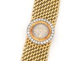 a lady ' s gold and diamond wrist watch