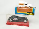 two toy cars that are sitting in a clear box