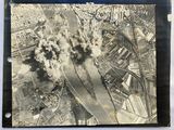 an old black and white photo of smoke billowing out of a factory