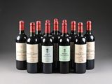 six bottles of red wine lined up in a row