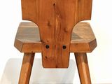 a wooden chair that is sitting on a hard wood floor