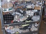 a metal cart with many items in it in a warehouse