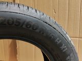 a close up of a tire on a wooden floor next to a cardboard box