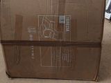 a box that is sitting on the floor in the room