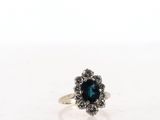 a close up of a ring on a table with a white background