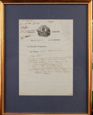 framed photograph of a letter signed by a man in a suit and tie