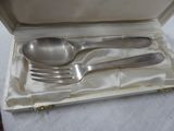 a box with silverware in it on a table