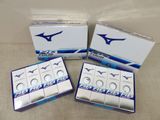 three boxes of mizuno condoms sitting on top of a table