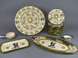 many plates and bowls that are sitting on a table