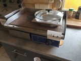a frying pan sitting on top of a stove