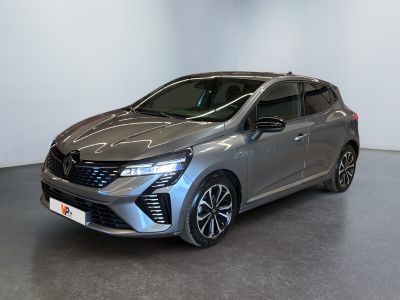 the grey car is parked in a room with a white wall