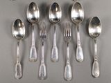 six spoons and six spoons on the table