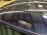 a parking meter on top of a car in a garage
