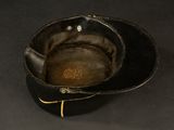 a black hat that has a brown patch on it