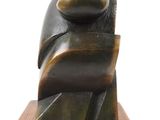 abstract bronze sculpture of a woman on a wooden base