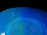a blue frisbee sitting on top of a black table
