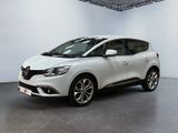 a white car in a white room with a black floor