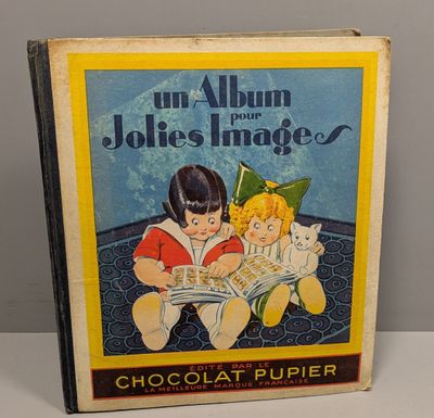 an old children ' s book with a picture of two children reading a book