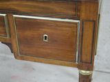 a small wooden table with a drawer on top of it
