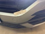 a close up of the front bumper of a car with a sticker on it