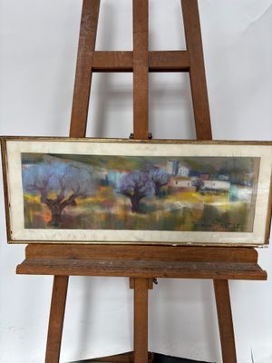 une peinture à l'huile représentant un paysage, posée sur un chevalet, sur fond blanc